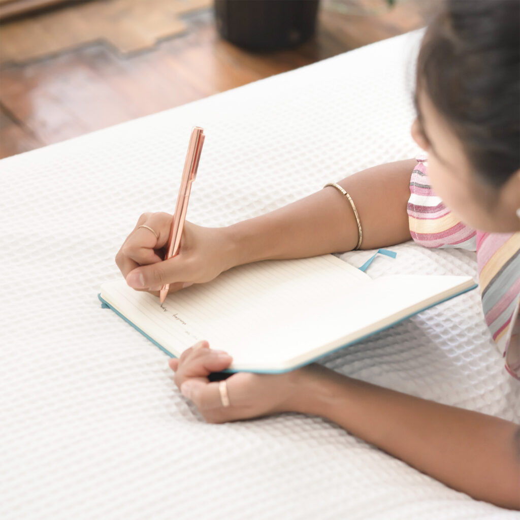 Woman writing in a notepad